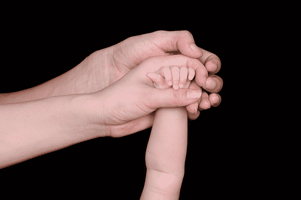 The Coolness of the Eyes: How to Raise An Upright Muslim Child - Father and Mother holding an infant's hand